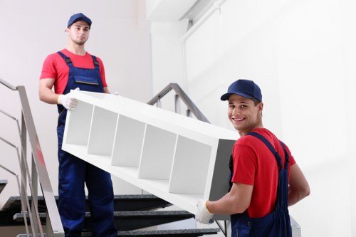 Removal team planning a move in Earls Court near local flats and busy streets