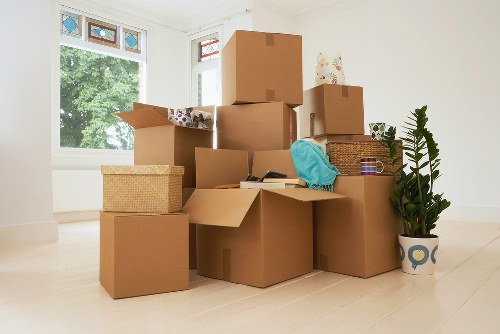 Packed office equipment ready for relocation in Earls Court