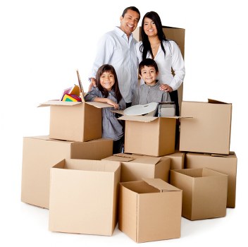 Local movers organising packed boxes in an Earls Court flat